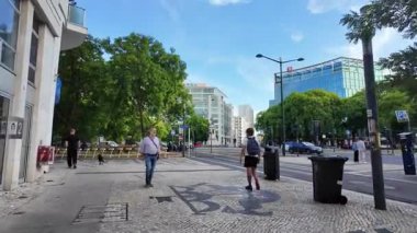 Lisbon Portugal summer POV urban photo old town cobblestone houses sunny travel lifestyle