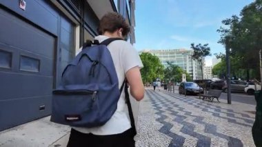 Summer POV Lisbon Portugal narrow street walking photo with colorful tiled architecture