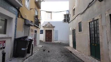 Summer Lisbon POV walk through historic houses with urban travel tourism lifestyle