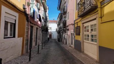 Sunny day POV Lisbon walking city scene with colorful houses European tourism photo