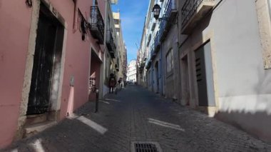 Summer Lisbon Portugal POV street walking scene with urban travel tourism background