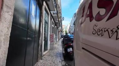 Summer POV Lisbon street scene with tiled houses European travel concept urban tourism in Portugal