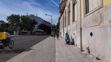 Lisbon old town POV summer walking photo with colorful architecture vibe
