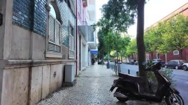 Summer walk Lisbon POV through old town streets and historic architecture