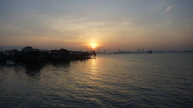 Tan klan İskelesi George Town, Penang güneş doğarken sırasında doğal görünümü