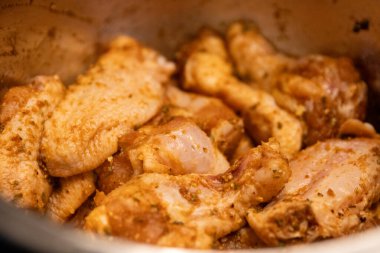 Seasoned Raw Chicken Wings marinating