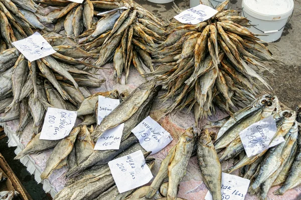 Dried salted fish lying on the counter. City market, Russia.