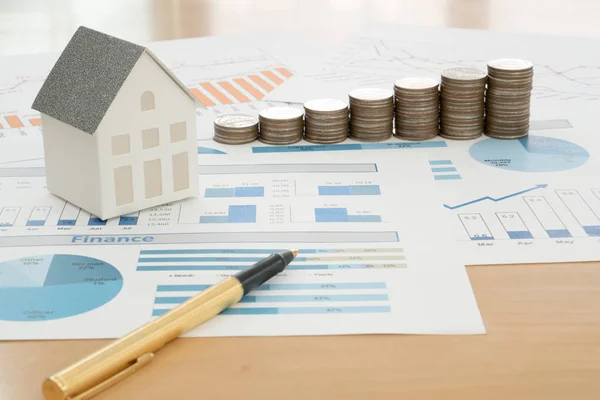 With House Model And Stack Of Coins On Desk — Stock Photo, Image