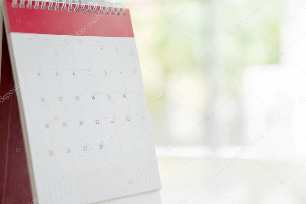 Calendar Standing On Brown Wood Surface