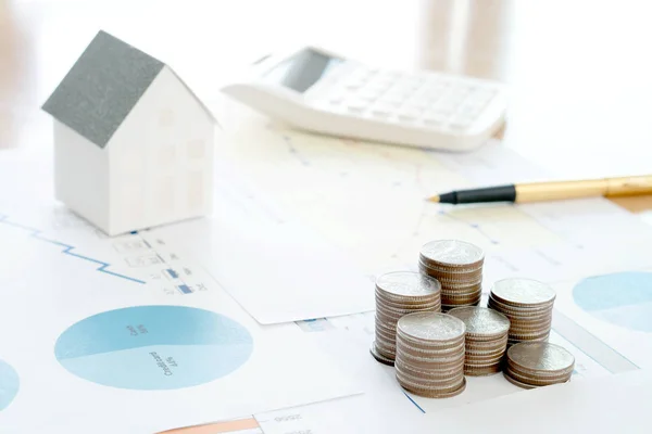 With House Model And Stack Of Coins On Desk — Stock Photo, Image