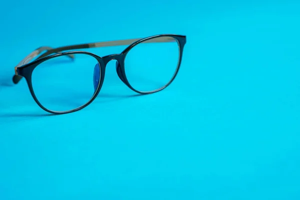 Glasses on a blue background — Stock Photo, Image