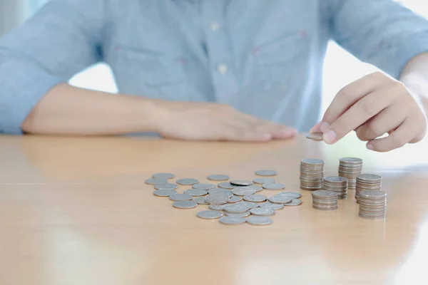 Counting or sorting coins of different types — Stock Photo, Image