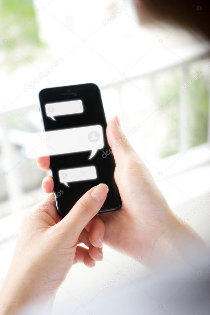 Hand of woman typing text on mobile smartphone. Online live chat