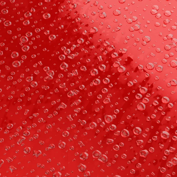 Kvadratisk bild av en droppe vatten på en plan röd yta — Stockfoto