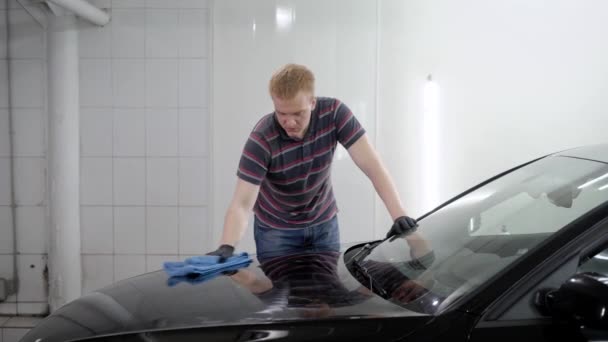Close Up Shot Of A Male Worker Polishing Hood After Waxing Stock Video Close Up Shot Of A Male Worker Polishing Hood After Waxing Stock Video