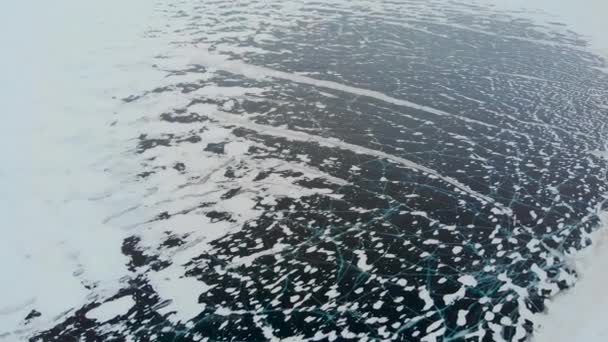 Aerial view of the winter frozen lake captured with a drone in Finland — Stock Video