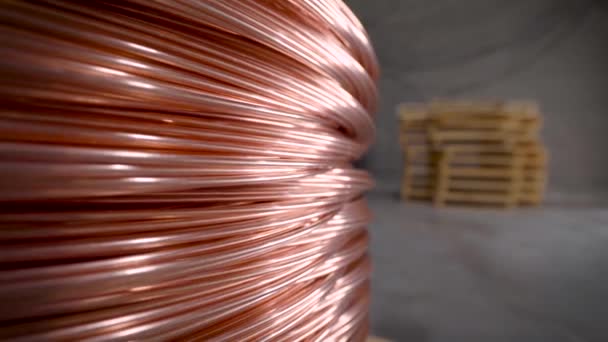 Copper rod. Thick copper wire coiled into a huge bobbin. Copper is one of the rare metals used everywhere. — Stock Video