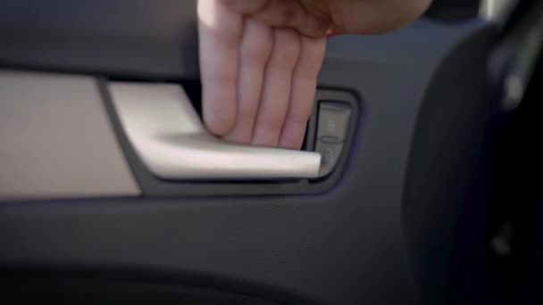 A male hand opens the drivers door of the car. Pleasant materials of a modern car — Stock Video