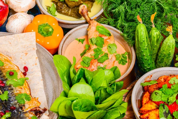 Traditional Georgian cuisine. Matzoon Okroshka, Khash Chikhirtma Harcho Soup, Dolma Chanakhi Chashululi Chkmeruli Kupati — Stock Image Traditional Georgian cuisine. Matzoon Okroshka, Khash Chikhirtma Harcho Soup, Dolma Chanakhi Chashululi Chkmeruli Kupati Stock Picture