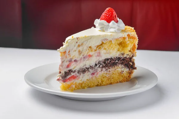 Piece Vanilla Chocolate Cake Icing White Blurred Background Served White — Stock Photo, Image