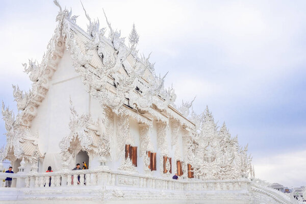 Tourists at Wat Rong Khun White Temple, Buddhist architecture, C