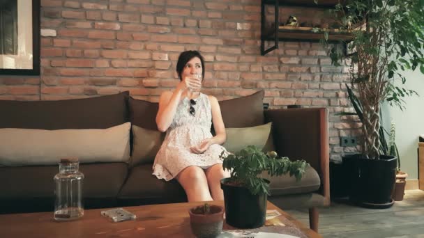 Lonely Caucasian woman in dress waiting her date in a cafe — Stock Video