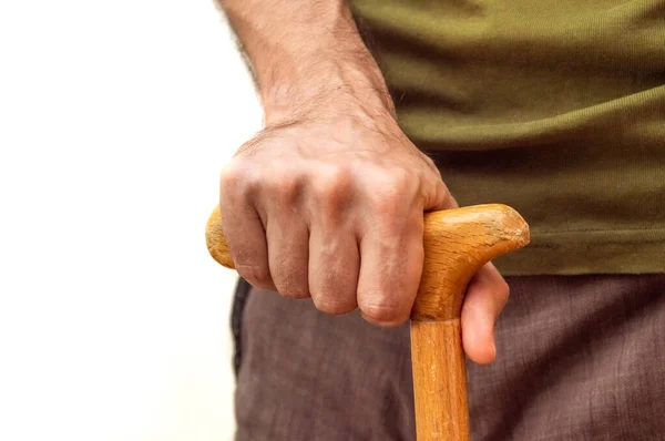 Male hand with walking stick — 스톡 사진