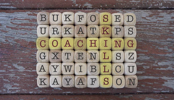 COACHING inscription made of scramble game cubes