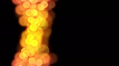 Soyut bokeh ışık parıldıyor gradyan rengi sarı ve pembe illüstrasyon koyu arka plan, kesintisiz döngü animasyon üzerinde 4 k doğru kopya alanı ile desen.