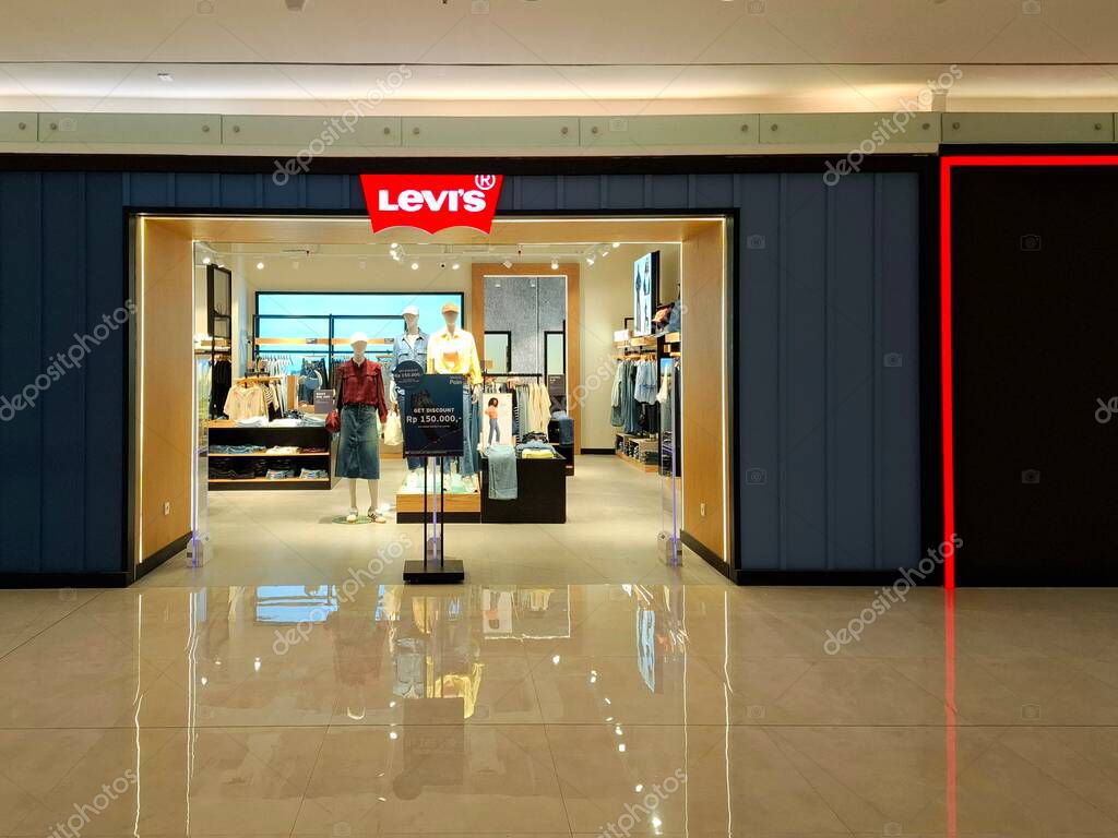Surabaya, Indonesia, September 9, 2025.The front of a casual clothing store, Levis, features an elegant, masculine, comfortable, and welcoming design. Eye-level view.