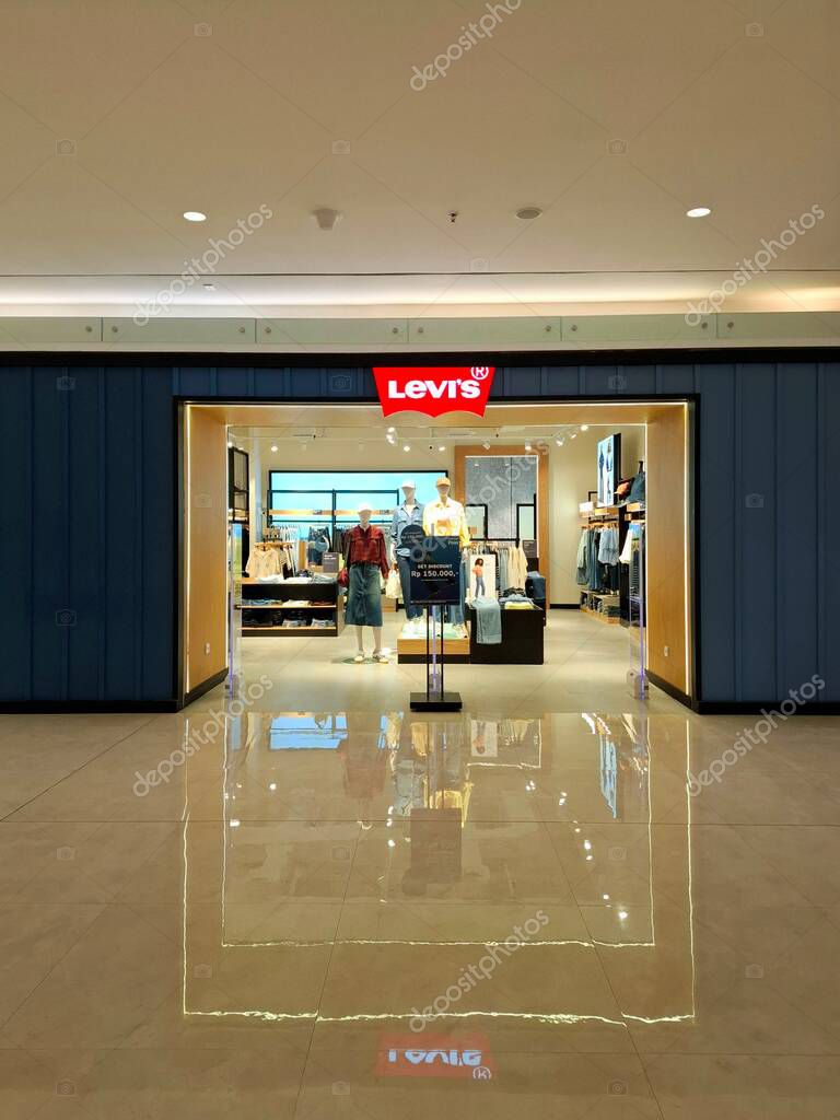 Surabaya, Indonesia, September 9, 2025.The front of a casual clothing store, Levis, features an elegant, masculine, comfortable, and welcoming design. Eye-level view.