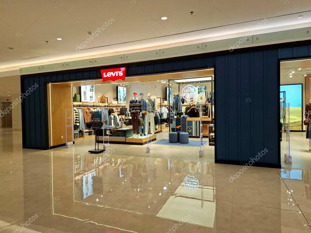 Surabaya, Indonesia, September 9, 2025.The front of a casual clothing store, Levis, features an elegant, masculine, comfortable, and welcoming design. Eye-level view.
