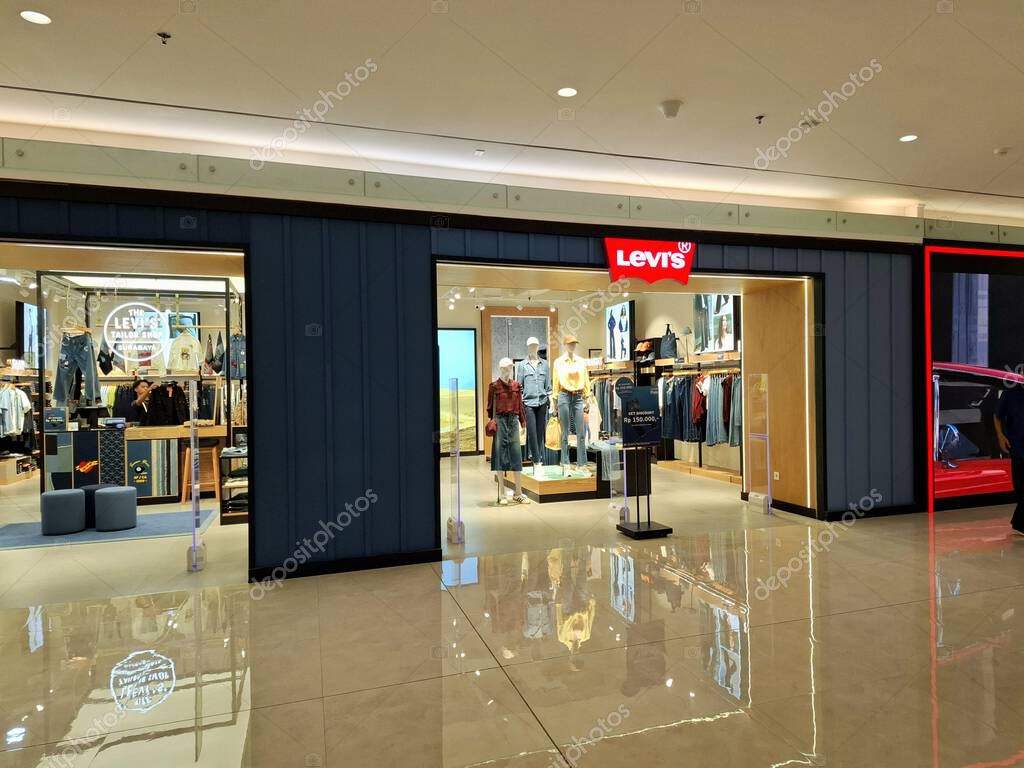 Surabaya, Indonesia, September 9, 2025.The front of a casual clothing store, Levis, features an elegant, masculine, comfortable, and welcoming design. Eye-level view.