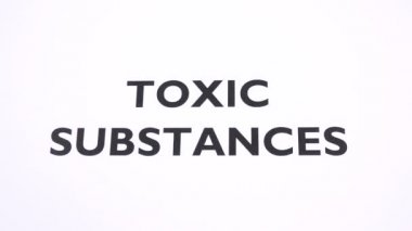 TOXIC SUBSTANCES prohibition symbol, health risk ban writing with copy space. No poison, chemical free, pollution reducing, negative sign with white background. Concept of healthy lifestyle