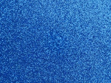 Canlı mavi parıltılı dokunun yakın plan fotoğrafı. Görüntü binlerce yansıtıcı parçacığın dinamik, ışıltılı ve parıltılı bir yüzey oluşturduğunu gösteriyor. Bu soyut arkaplan festival, yaratıcı ya da dekoratif tasarım için idealdir.