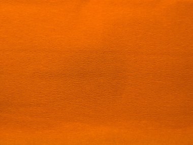 Turuncu desenli deri yüzeyin yakın görüntüsü. Görüntü ince taneciklerin ve ince dokunsal dokuların detaylı bir örneğini gösteriyor. Tasarım projelerinde, web sitelerinde veya ürün sunumlarında kullanılabilir.