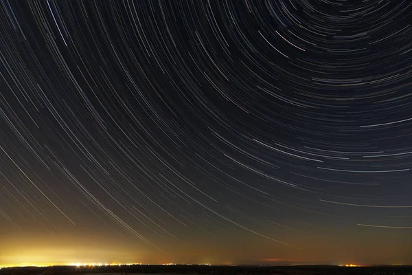 Star trails in the night sky. A view of the starry space in the