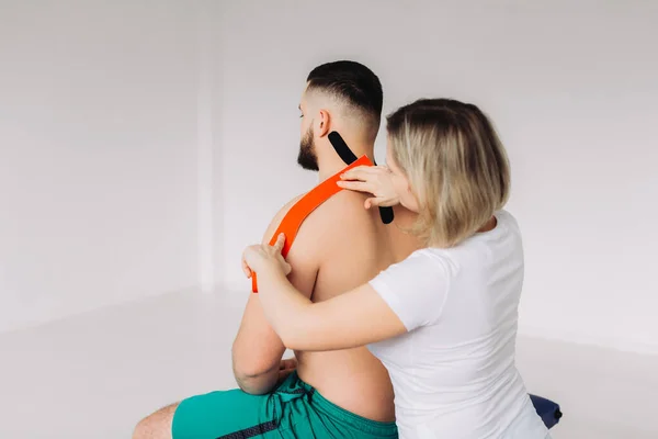Physiotherapist Applying Red Black Kinesio Tapes Patients Back His Office — Stock Photo, Image
