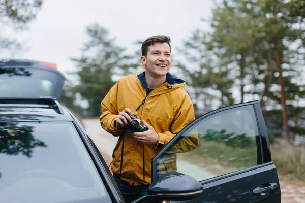 Young Man Holding Retro Photo Camera — Stock Photo, Image