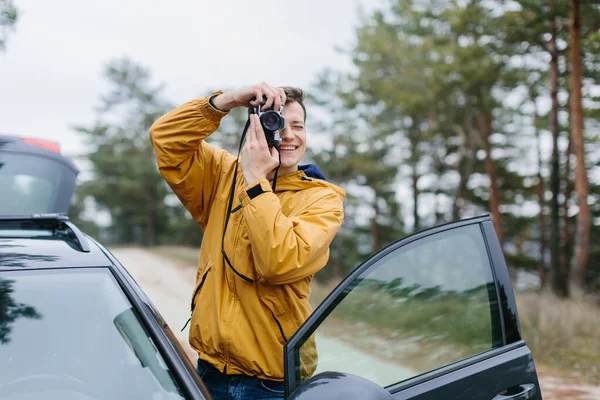 Young Man Holding Retro Photo Camera — Stock Photo, Image