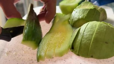 Healthy Ingredients for Salad Bowls of Tomato, Avocado, Carrot, Cheese, and Sliced Cucumber. High quality 4k footage