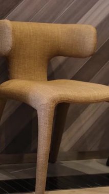 Beige modern chair beige interior background. . High quality FullHD footage