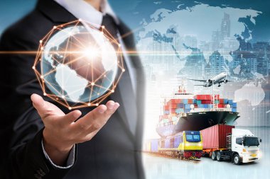 Businessman holding digital globe in palm for logistics import export background and container cargo freight ship transport concept clipart