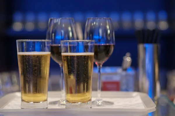 Two glasses of beer in tray ready to serve.