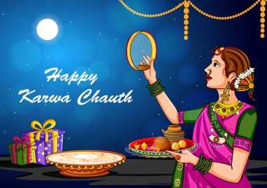 Karwa Chauth kutlamalarında aya bakan Hintli kadın