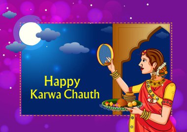 Karwa Chauth kutlamalarında aya bakan Hintli kadın