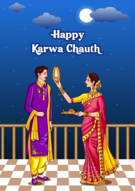 Karwa Chauth kutlamalarında aya bakan Hintli kadın