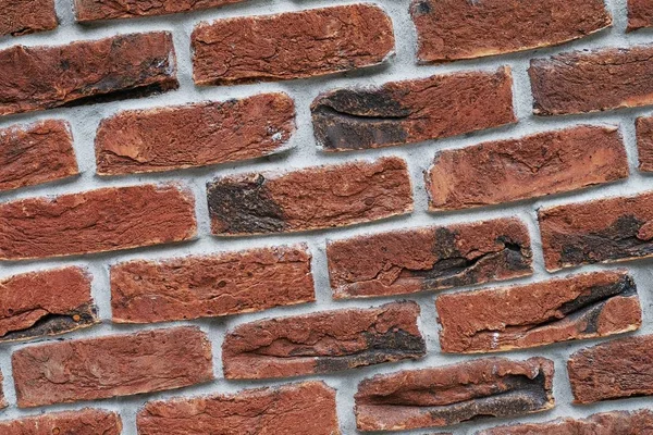 Red brick wall. The facade of the building with new plaster. Abstract banner. Brickwork. Background. Texture.