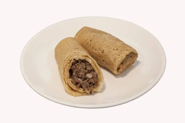 Traditional Russian Fried Stuffed Pancakes Blintzes with Meat.