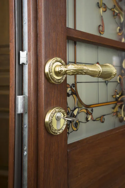 Open door of a family home. Close-up of the lock with your keys on an armored door. Security.